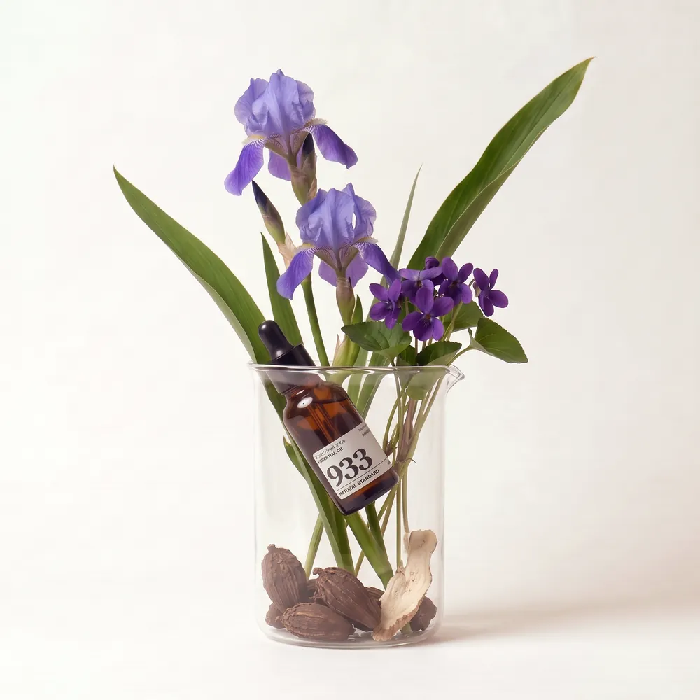 Essential Oil Blend No.933, Nine Three Three · essential oil bottle arranged with ingredients | Lê Mai