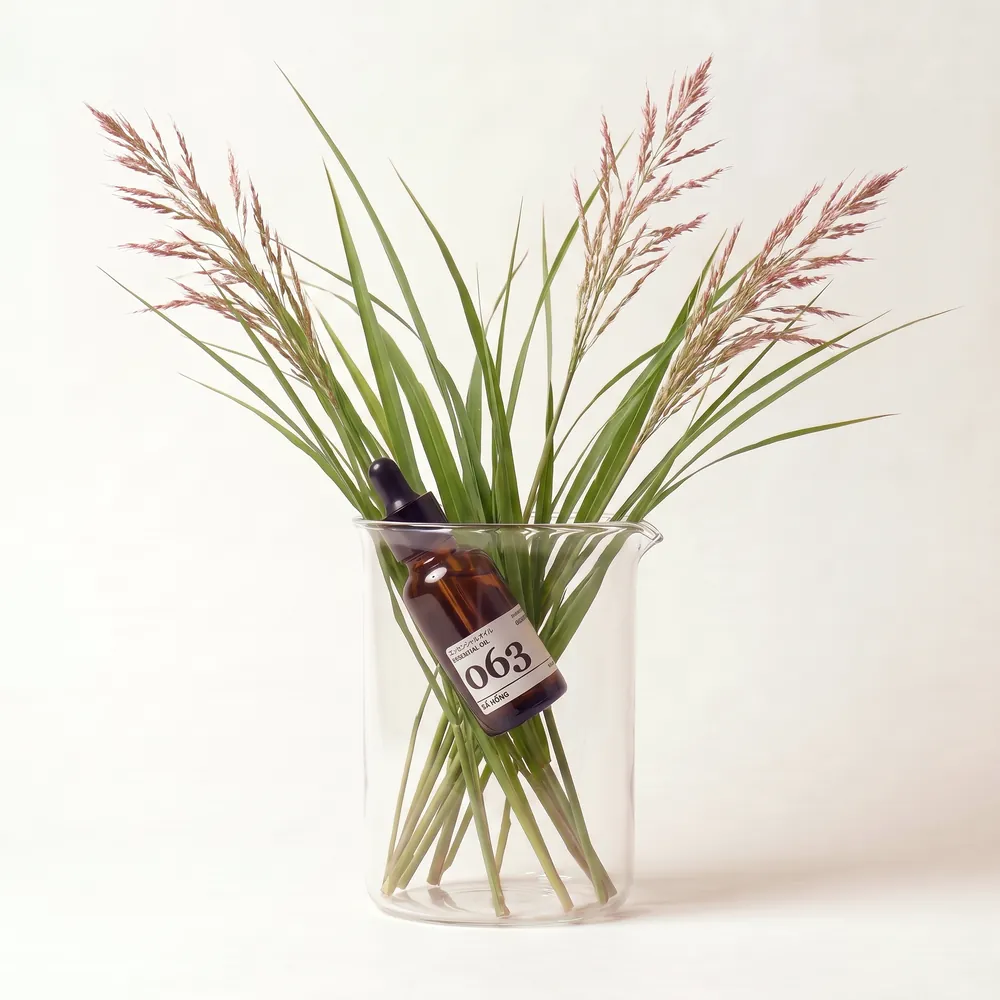 Palmarosa Essential Oil · essential oil bottle in a glass of ingredients | Lê Mai