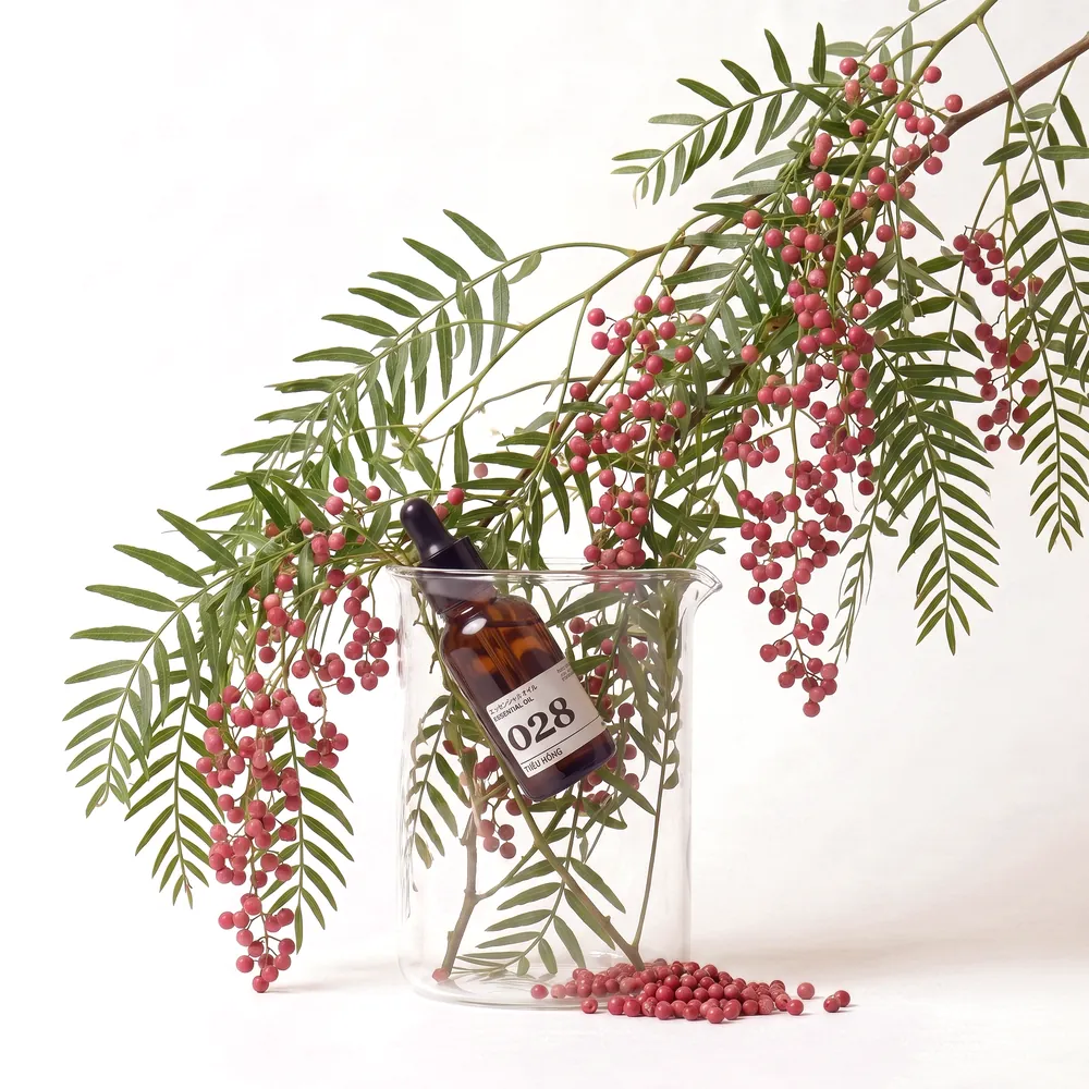 Pink Peppercorn Essential Oil No.028 · essential oil bottle in an ingredient glass | Lê Mai