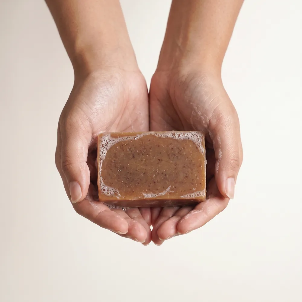 Mixed Herbs Ta Artisanal Soap No.113 · hand lathering a soap bar | Lê Mai