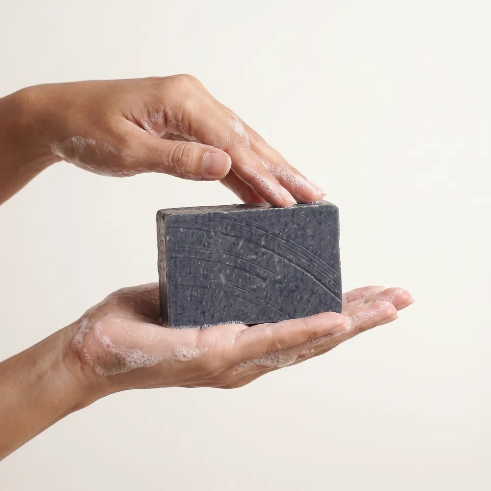 Mugwort Artisanal Soap No.103 · hand lathering the soap bar | Lê Mai