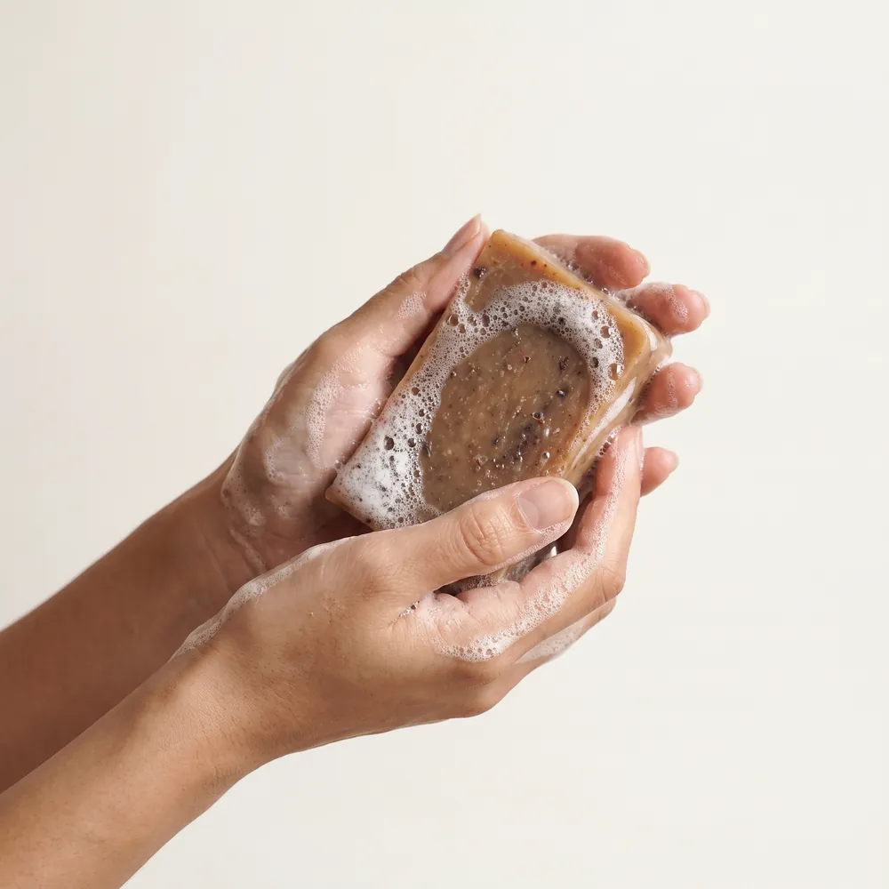 Lavender Artisanal Soap · hand lathering a soap bar | Lê Mai